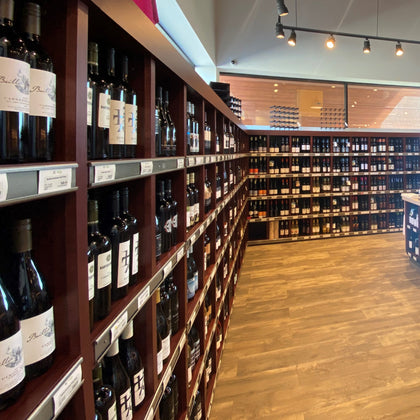 Long shelves with British Columbia VQA wine. Currently stocking over 900 wines from 155 different producers.